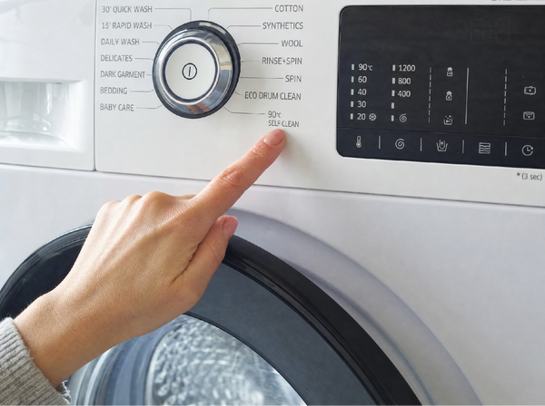 Washing machine running a hot empty self-clean cycle