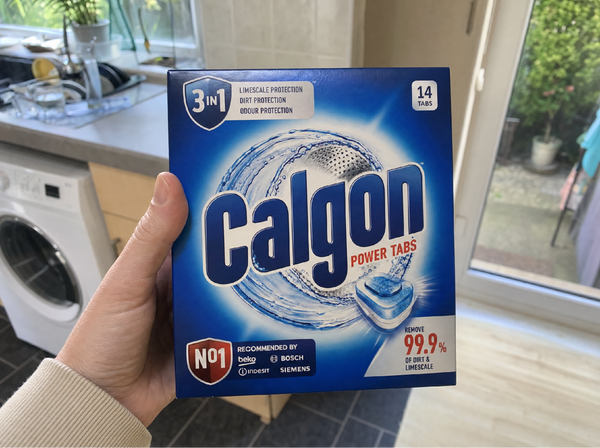 Supermarket washing machine cleaner tablets on a kitchen worktop